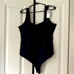 Abercrombie black sleeveless body suit. New with tags, never worn. Size XL.